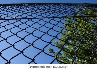 Chain Link Fencing Around A Local Club Tennis Court 