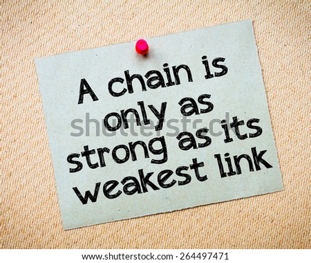 A chain is only as strong as its weakest link Message. Recycled paper note pinned on cork board. Concept Image