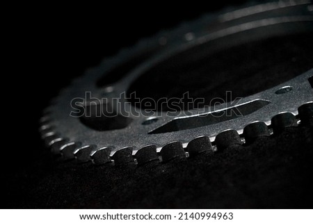Chain sprocket for motorcycle. With a steel and made it look beautiful on a black and dark background.