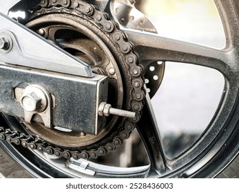 chain sprocket on the rear wheel, close up of motorcycle chain and sprocket, motorcycle rear chain with brake disc - Powered by Shutterstock