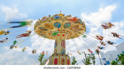 Chain Swing Ride In Amusement Park  