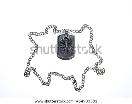 
a chain of white metal with pendant in the form of a scorpion