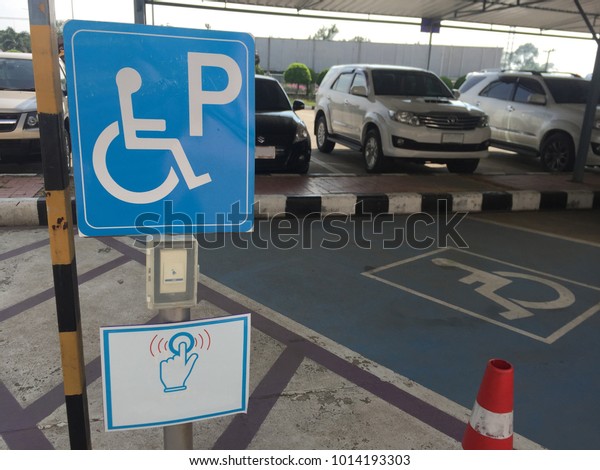 Chainat/Thailand - Jan 31 2018:Disabled
parking sign and Emergency button near the disabled
parking.