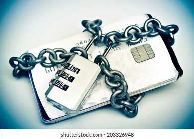 chained credit cards security lock with password - phishing protection concept