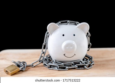 Chained Piggy Bank And Lock Money Savings With Chain And Keys. Money Security Concept.