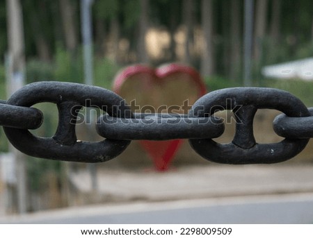 Chained red heart, as playing with perspective in a small village of La Rioja