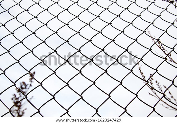 A chain-link fence\
is a type of woven fence usually made from galvanized or\
LLDPE-coated steel wire.