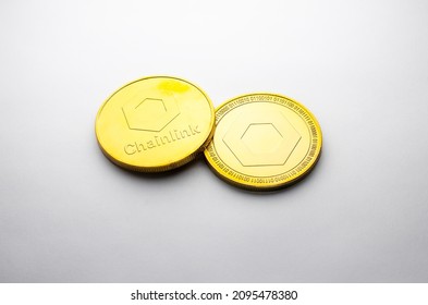 A Chainlink golden coin photographed on a white background, as a product shooting 