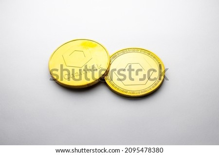 A Chainlink golden coin photographed on a white background, as a product shooting 