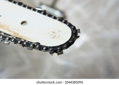 Chainsaw Repair, Close-up. Dirty Chainsaw With Sawdust 