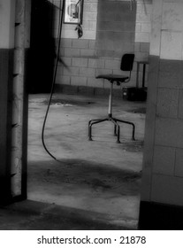 Chair in an abandoned factory. B/W.