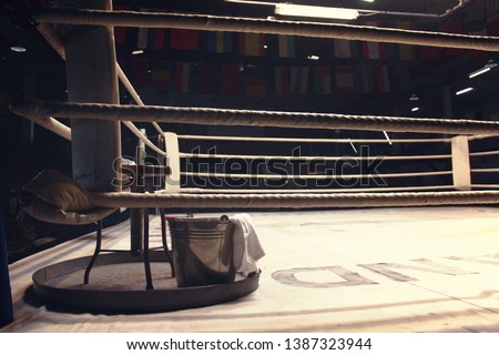 chair, bucket, towel and tray put on a corner of boxing ring