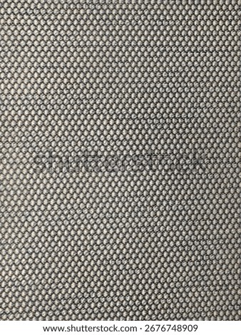 The chair fabric features diagonal patterns woven in dark grey and light grey, with European or German design style, evoking a substantial yet fresh feel.