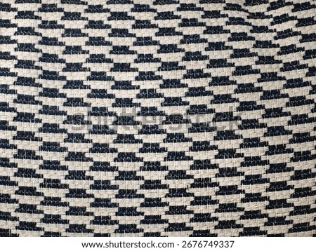The chair fabric features diagonal patterns woven in dark blue and white, with European or German design style, evoking a substantial yet fresh feel.