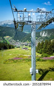 Chair lift above the village of La Clusaz in summer, France