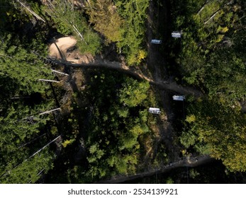 The chair lift in the mountains transports skiers to the slopes in the winter and cyclists riding trill tracks on mountain bikes in the summer. - Powered by Shutterstock