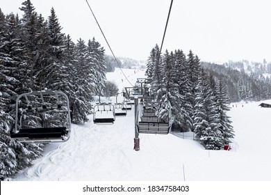 Chair Lift In Ski Center Les Arcs, Paradiski On The French Alps On A Winter Snowy Day