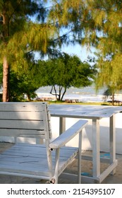 Chair And Table With Sea Ocean View For Relaxing Holiday Vacation. With View Of Summer Sea Breeze And Tree. Sunny Outdoor Scene. Nature Escape. Beautiful And Calm Sea View.