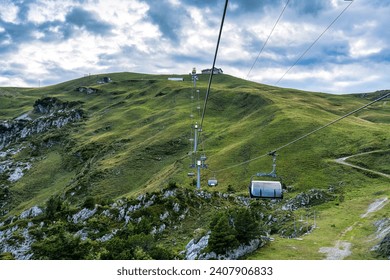 Chairlift or cable car riding over Swiss Alps on Stoos village and mountain landscape at Morschach, Schwyz, Switzerland