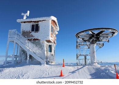 Chairlift Side Angle At A Ski Resort In Schweitzer, Idaho. Completely Covered In Snow From Daily Snow Drifts. Very Beautiful On A Rare Sunny Day.