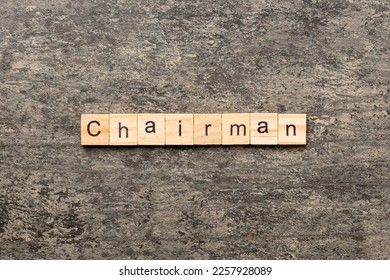 CHAIRMAN word written on wood block. CHAIRMAN text on cement table for your desing, concept. - Shutterstock ID 2257928089