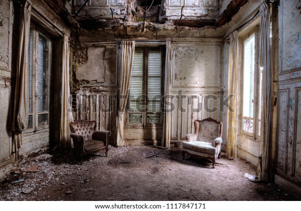 Chairs in an abandoned\
room in france