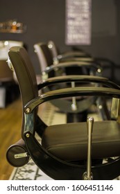 
Chairs In A Barber Shop With All Black Color.