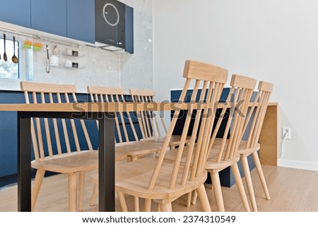 Chairs and dining table arranged neatly