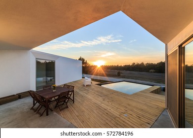 Chairs In Modern House With Wooden Deck