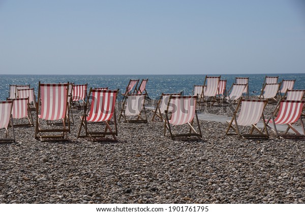 chairs on the beach in beer,\
Devon