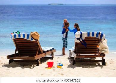 chairs on tropical beach, family beach vacation