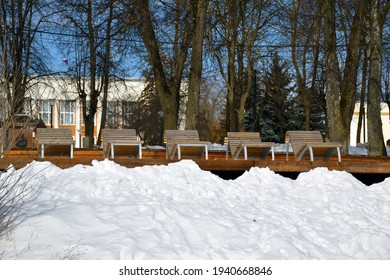 Chairs For Outdoor Recreation. Wooden Benches On The River Bank. Winter City.