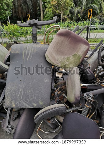 chairs that have been used and damaged and stored in a special place for disposal