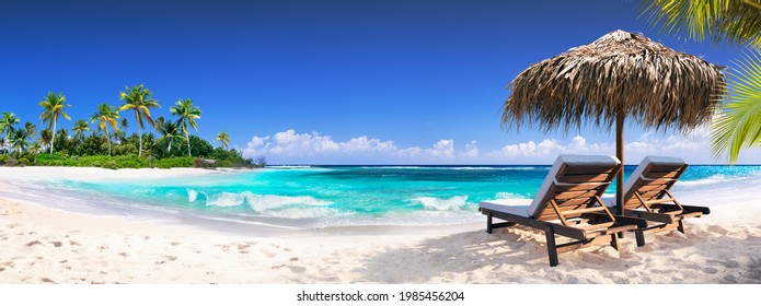 Chairs In Tropical Beach With Palm Trees On Coral Island - Powered by Shutterstock