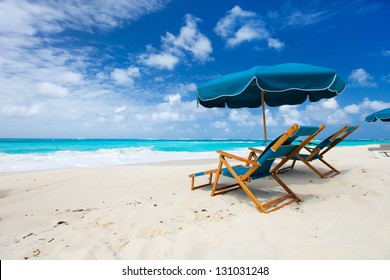 Chairs and umbrella on a beautiful tropical beach at Anguilla, Caribbean