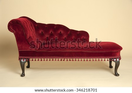 Chaise longue seat covered in a dark red velvet