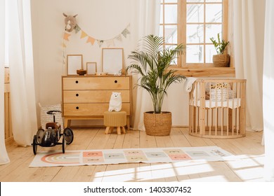 Chalet Baby Bedroom Interior with Cozy Cradle Bed. Light Brown Childish Room with Wooden Empty Cot. Cosy Home Hygge Style Design. Beautiful Child Toy in Large Cottage Background. Modern Eco House