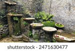 The Chalice Well, Red Spring, natural water source at the summit of The Tor in Glastonbury, Somerset, England UK