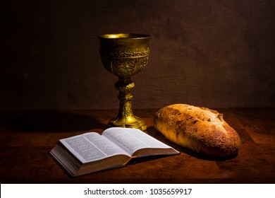 Chalice With Wine Bread And Holy Bible On A Table. The Last Supper.