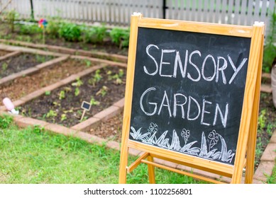 Chalk board next to the garden bed