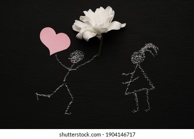 Chalk drawing man is holding red heart   flower   running to girl  Blackboard chalkboard background  Valentines day  love  relationship  attraction concept  Flat lay