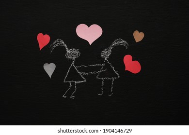 Chalk drawing woman   girl are holding arms  Blackboard chalkboard background  Valentines day  love  relationship  attraction concept  Flat lay