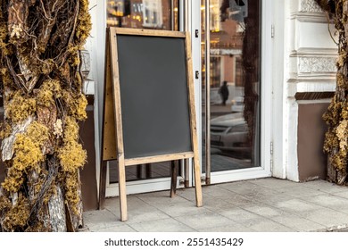 Chalk information board. Cafe or shop sidewalk wooden sign board. Mock up. Decorated entrance group