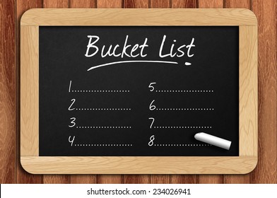 Chalkboard On The Wooden Table Written Bucket List