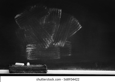 Chalkboard In School For Education With Eraser And Chalk Writing 