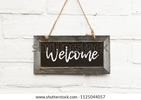 Chalkboard sign board with text welcome come in