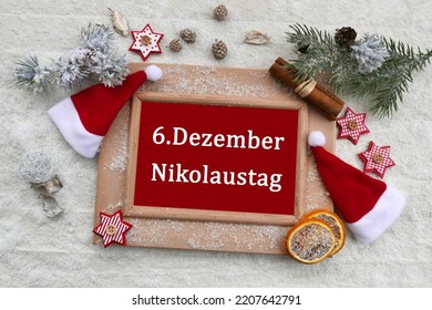 Chalkboard with the text  6. Dezember Nikolaustag.
6. Dezember Nikolaustag means translated December 6th is St. Nicholas Day. - Powered by Shutterstock