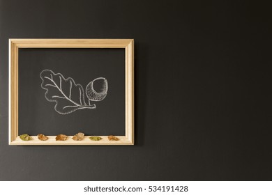 Chalkboard Wall With A Wooden Frame And An Acorn Painted There