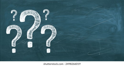 Chalk-drawn question marks on a blackboard background. Concept of choice, confusion, education, and finding answers in school or career - Powered by Shutterstock