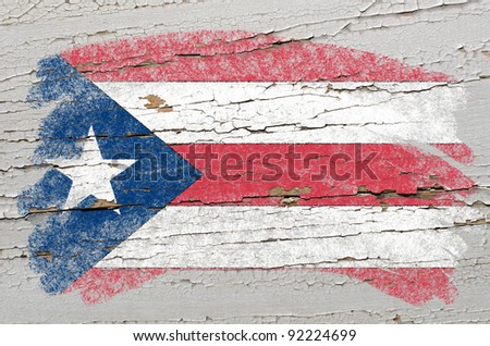 Chalky puertorican flag painted with color chalk on grunge wooden texture